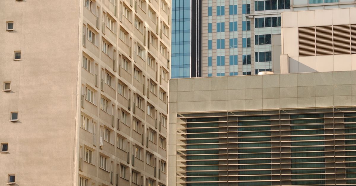 Parking Lot Next to High-Rise Buildings in the City Center · Free Stock ...