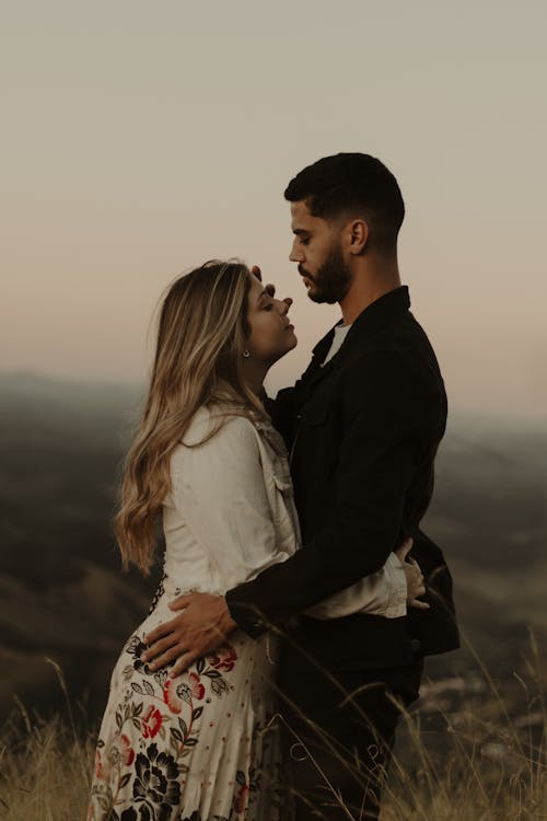 Free Woman and Man Embracing Each Other Stock Photo