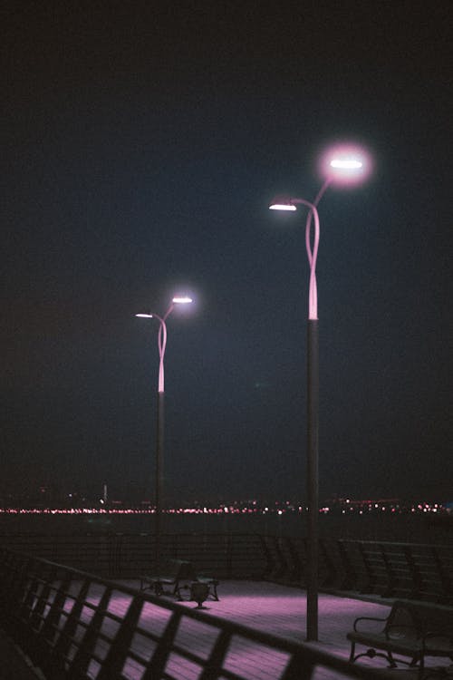 Lampposts on an Empty Pier at Night 