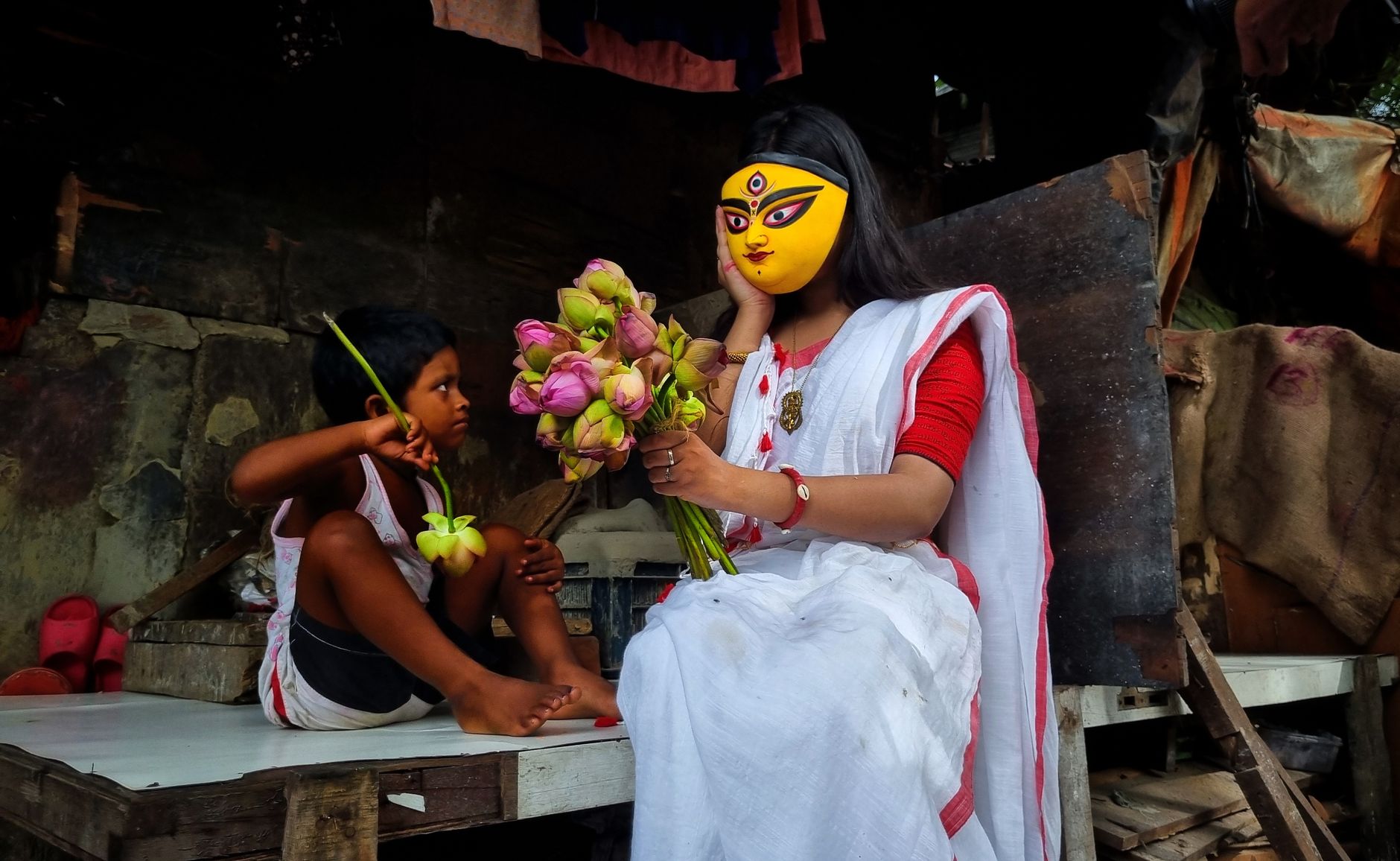 Bengali player reviewing identity verification and withdrawal terms on a tablet at a quiet desk