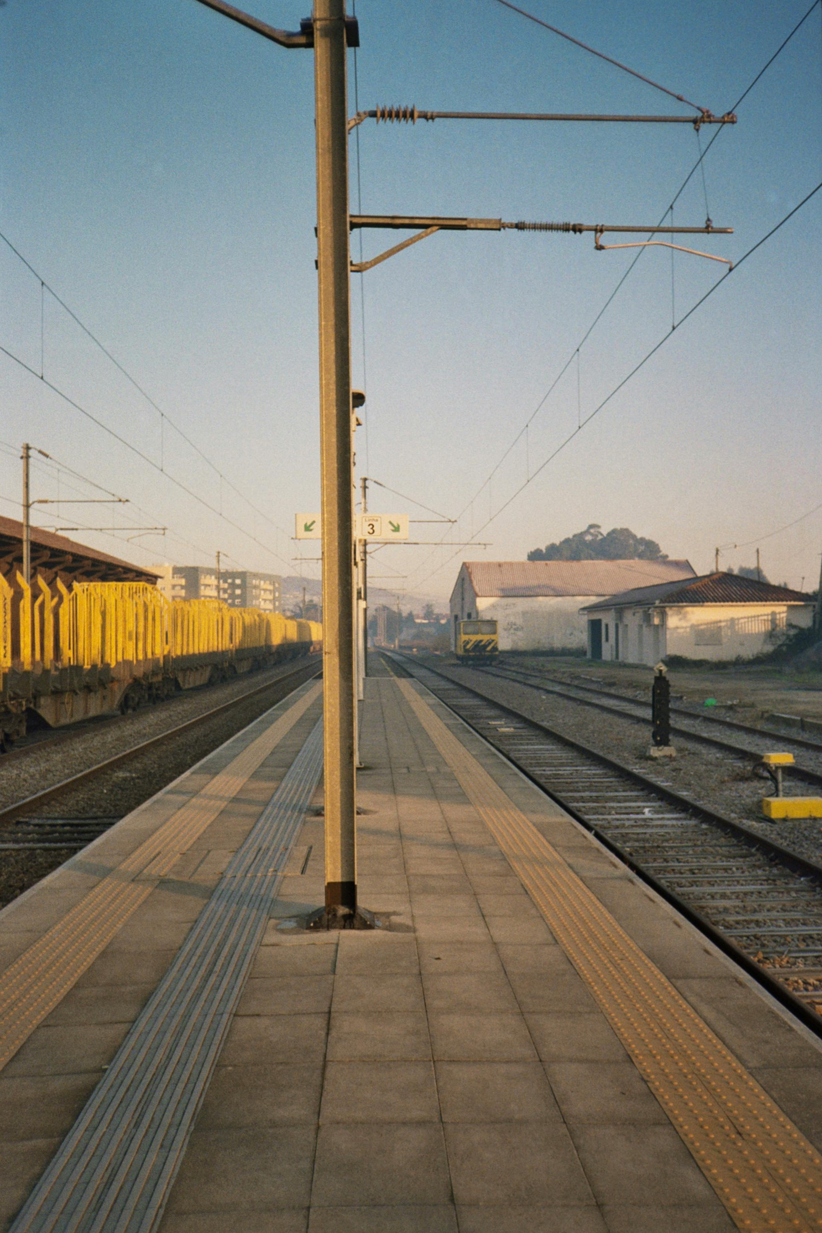 A quiet railway station in Barcelos, Portugal, captured in the serene morning light.
