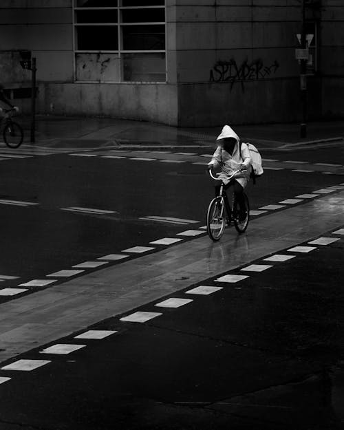 Person Crossing Street on Bike
