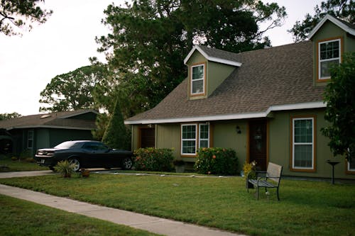 Residential House and a Car Parked in the Driveway