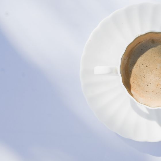 Fluted cup on a saucer in cool daylight, photo by Studio Naae on Pexels