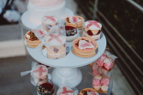 Free A beautifully arranged collection of desserts on an elegant serving stand, perfect for celebrations. Stock Photo