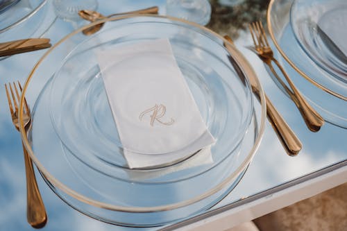 Glass Plate and Cutlery on the Banquet Table 