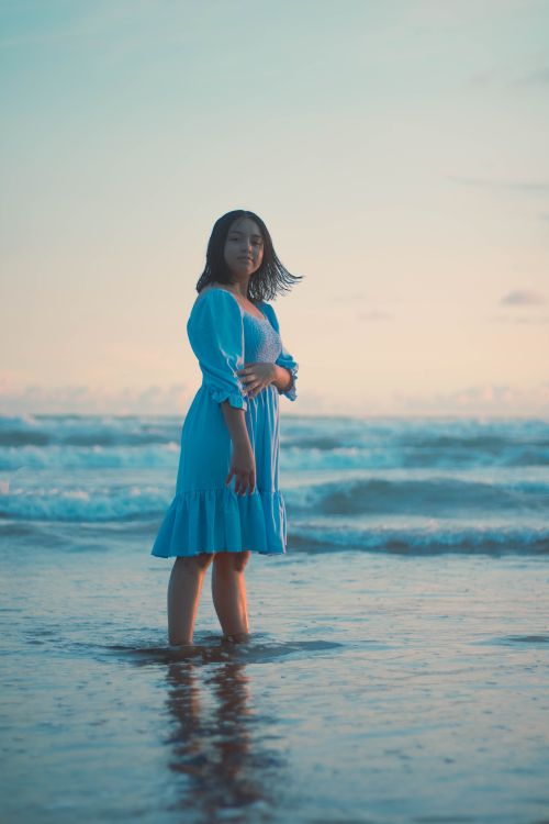 Girl Wearing Blue Dress Standing in the Sea at Dusk Free Stock Photo Girl Wearing Blue Dress Standing in the Sea at Dusk Free Stock Photo