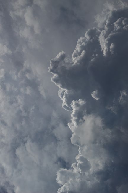 Stunning image of a dramatic cloud formation against a deep blue sky, capturing the essence of nature's beauty.