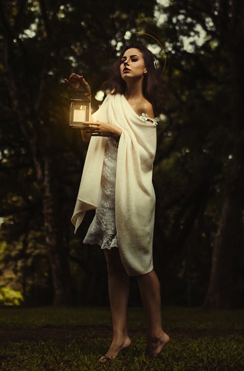 Woman Holding Candle Lantern