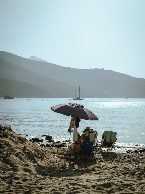 deniz, dikey atış, kum içeren Ücretsiz stok fotoğraf