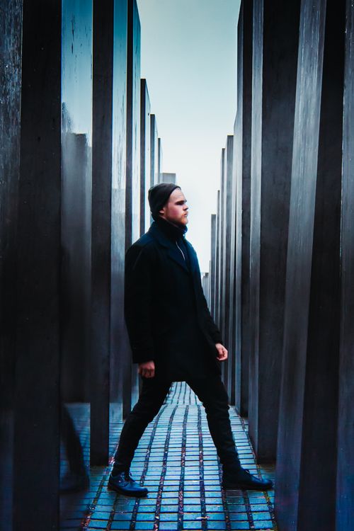 Free Man Standing Near Walls Stock Photo