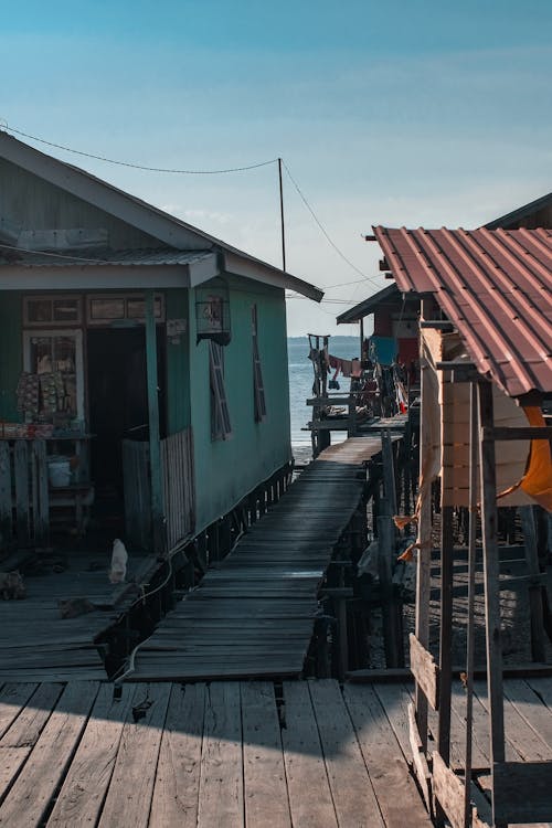 Wooden Footbridge between Seaside House Leading on Beach