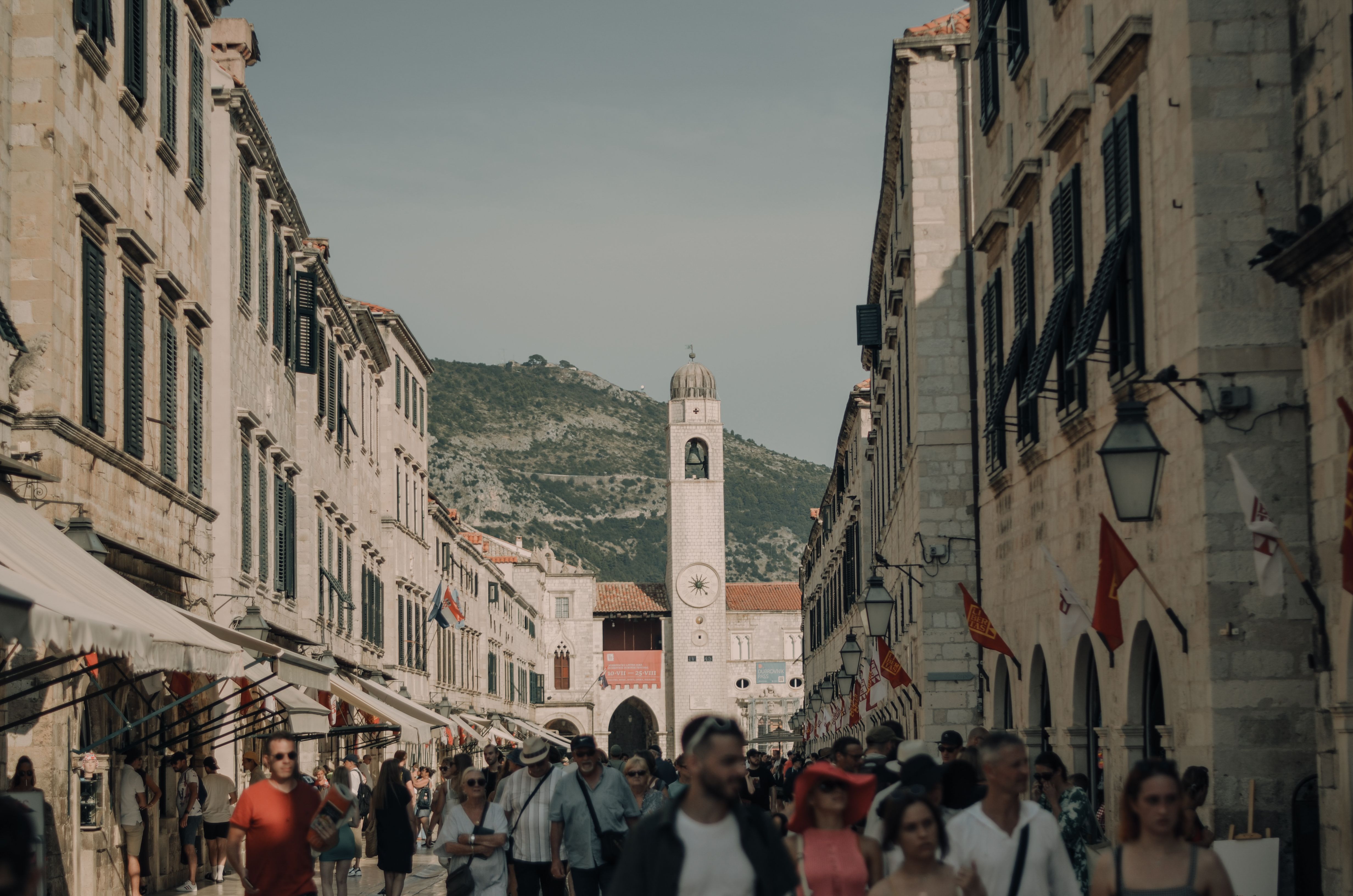 Easter procession leaving Dubrovnik Cathedral with candles and clergy in white robes