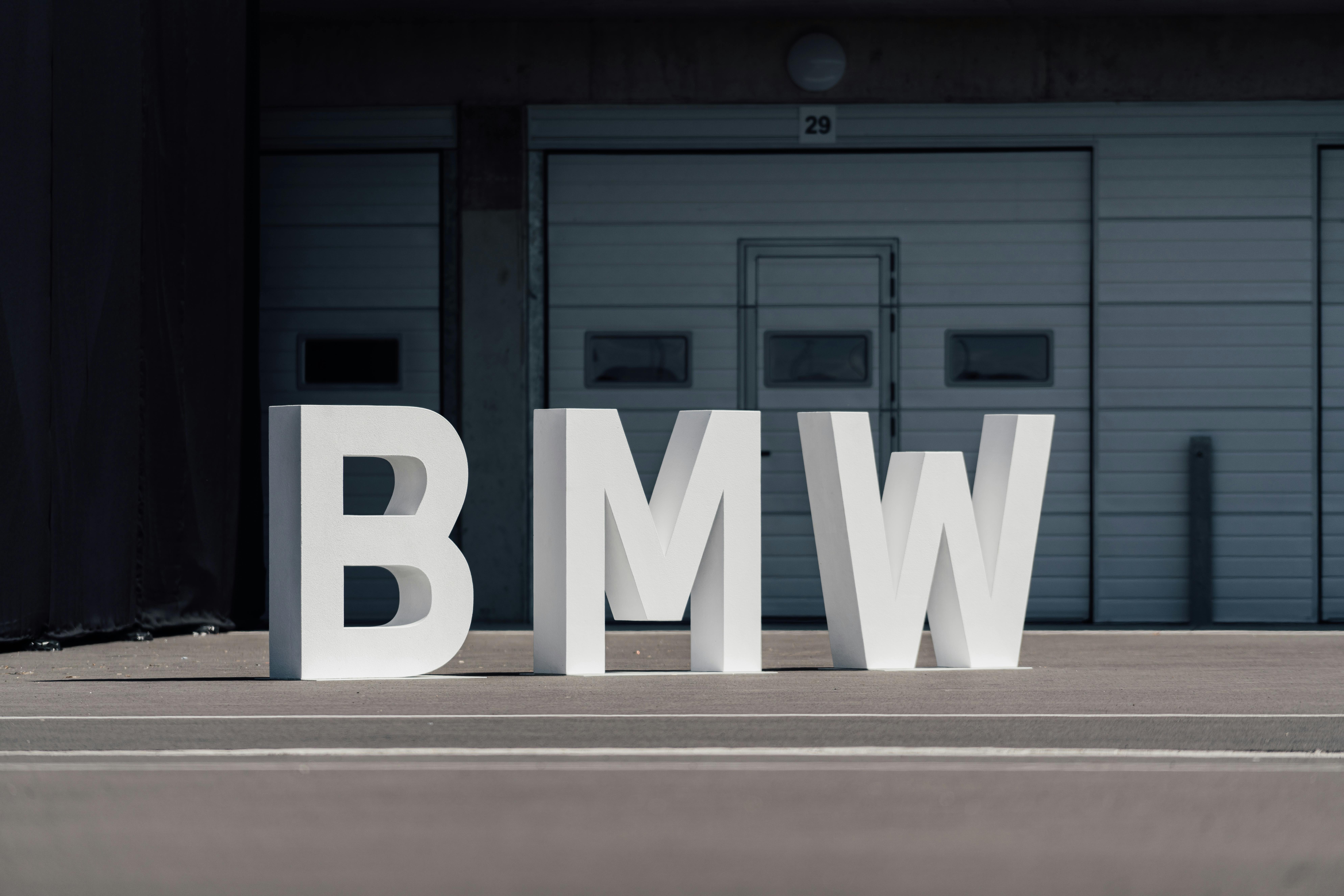 BMW Letters on Asphalt · Free Stock Photo