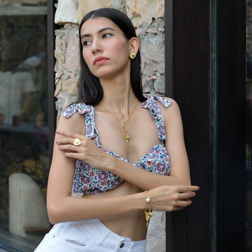 Young Fashionable Woman Wearing Gold Jewelry 