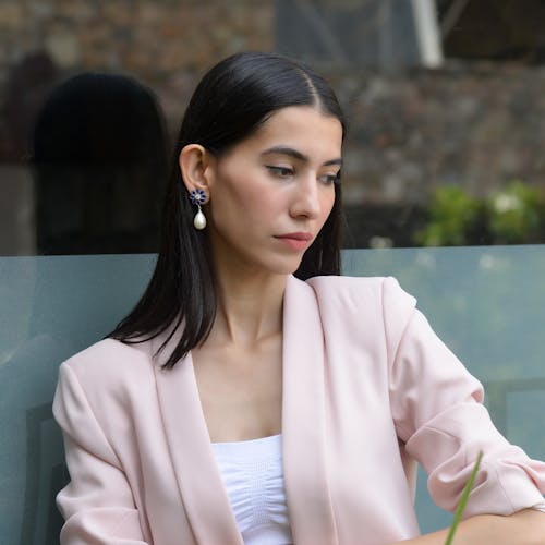 Young Elegant Brunette Wearing Dangle Earrings