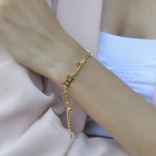 Close-up of Woman Wearing a Gold Bracelet 