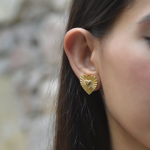 Close-up of Woman Wearing a Golden Earring 