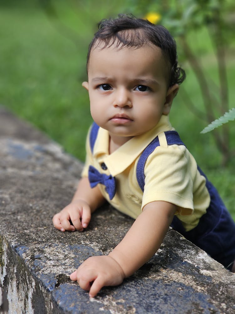 A Toddler Standing Outside 