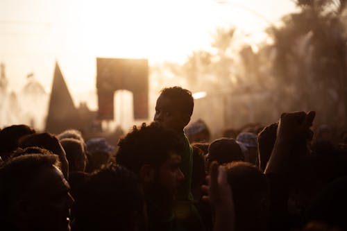 Back View of a Silhouetted Crowd at Sunset