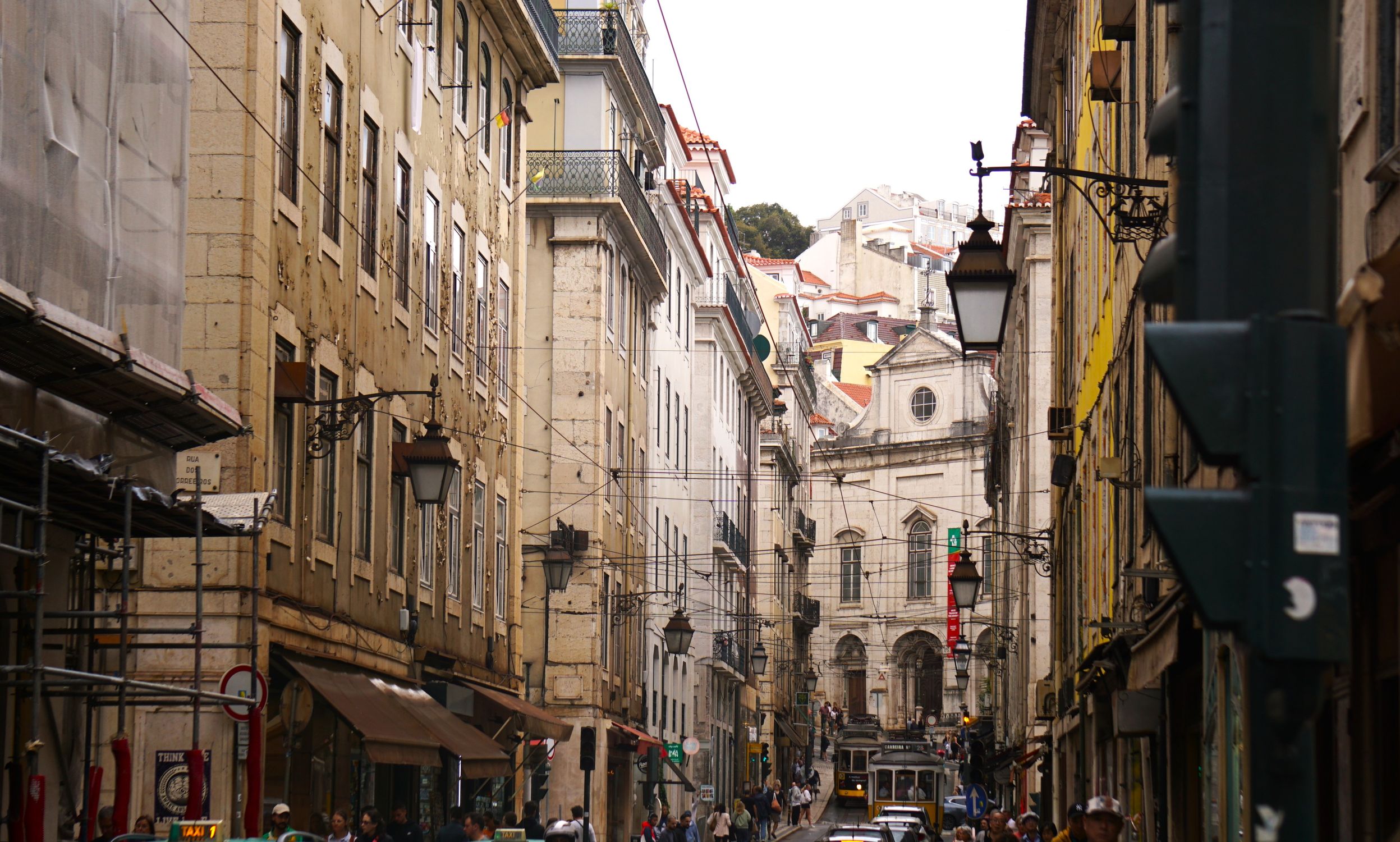 Discover the urban charm of Lisbon's historic streets with iconic tram, architecture, and vibrant life