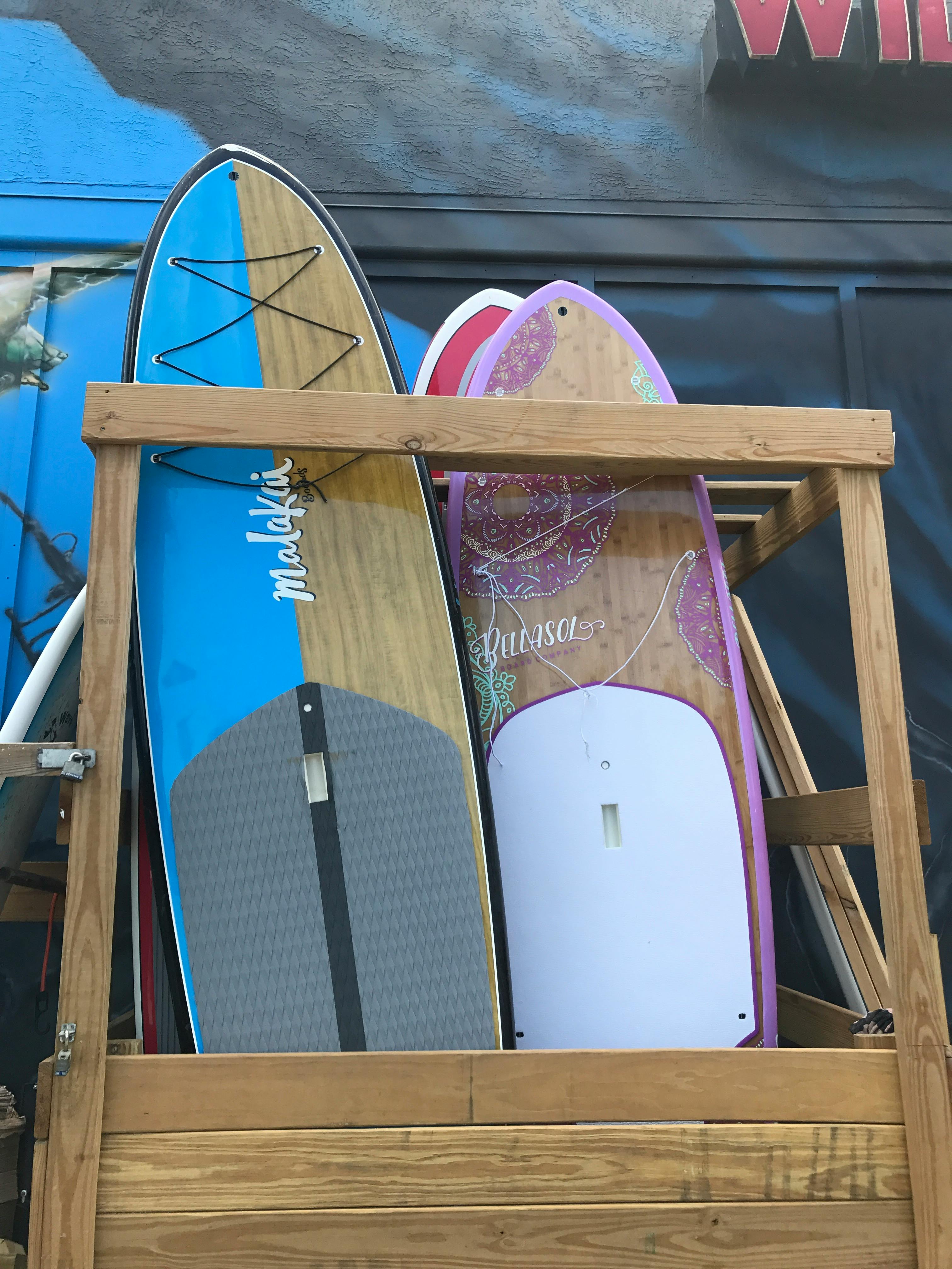 Free stock photo of surf up surfboards wood shelf surfshop nsb florida