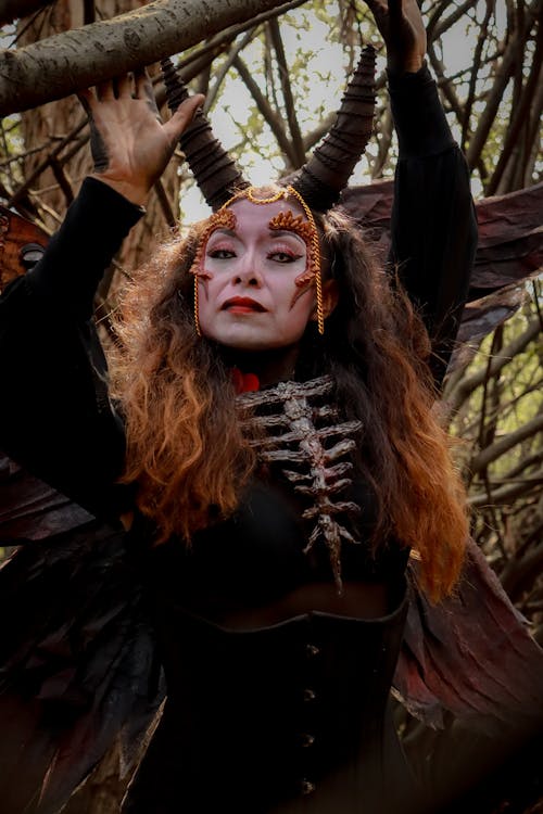 Portrait of Woman Wearing Halloween Costume in a Forest 