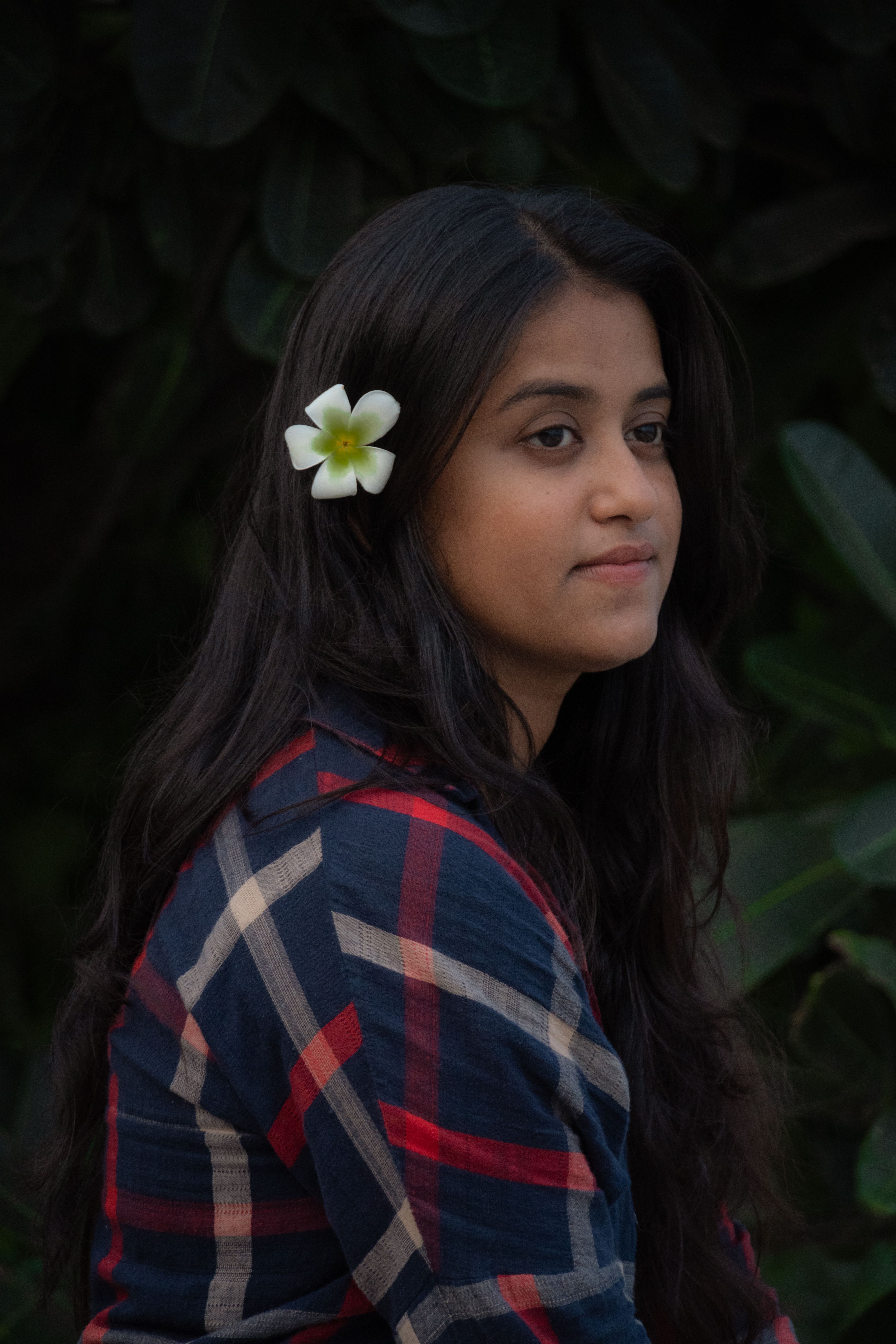 Portrait of Woman Wearing Flower in Hair · Free Stock Photo