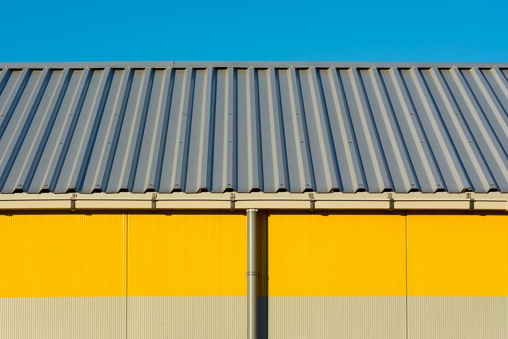 Exterior of a commercial warehouse building with a corrugated metal facade