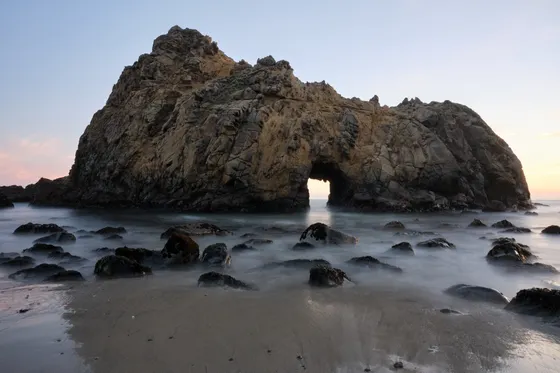 The purple sand and rock arch at Pfeiffer Beach, Big Sur