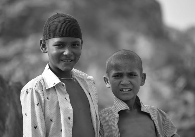 Portrait Of Two Boys Standing Outside 