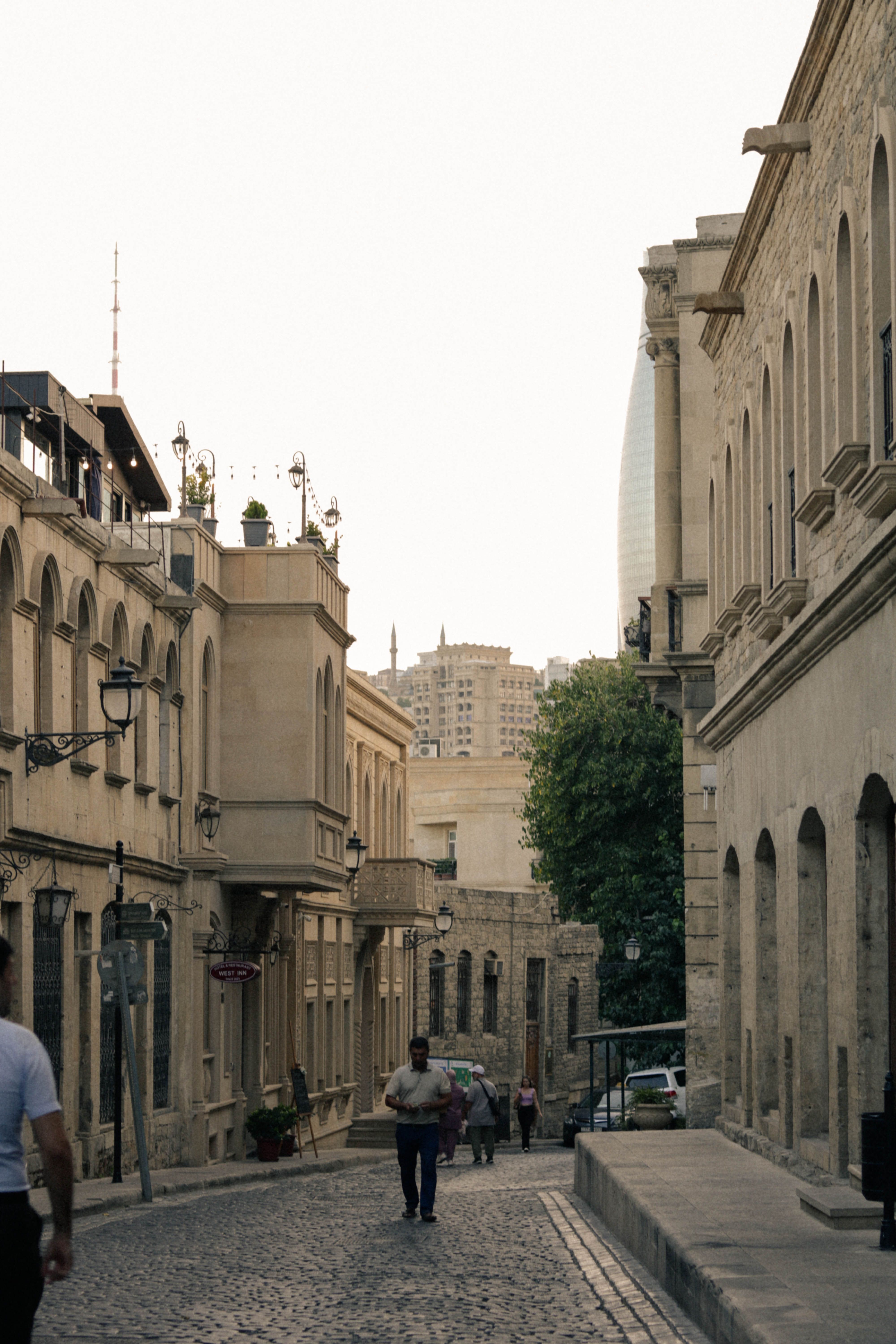 A Cobblestone Alley between Traditional Buildings in City · Free Stock ...