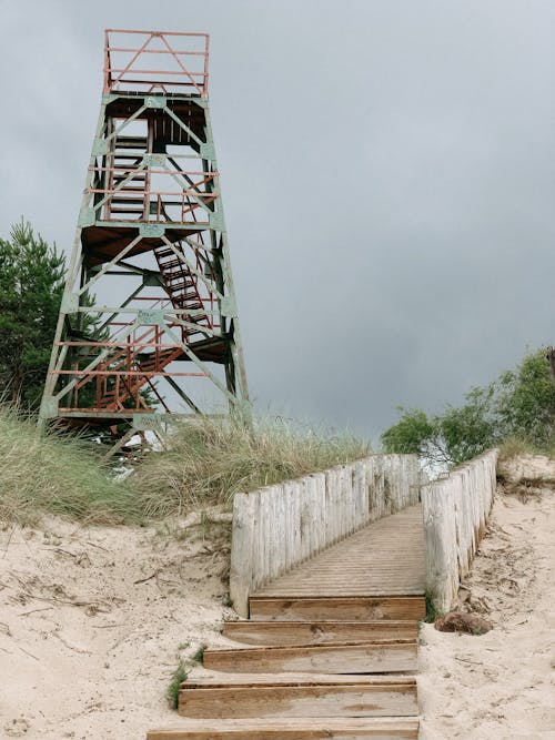 Watchtower by Wooden Boardwalk on Beach