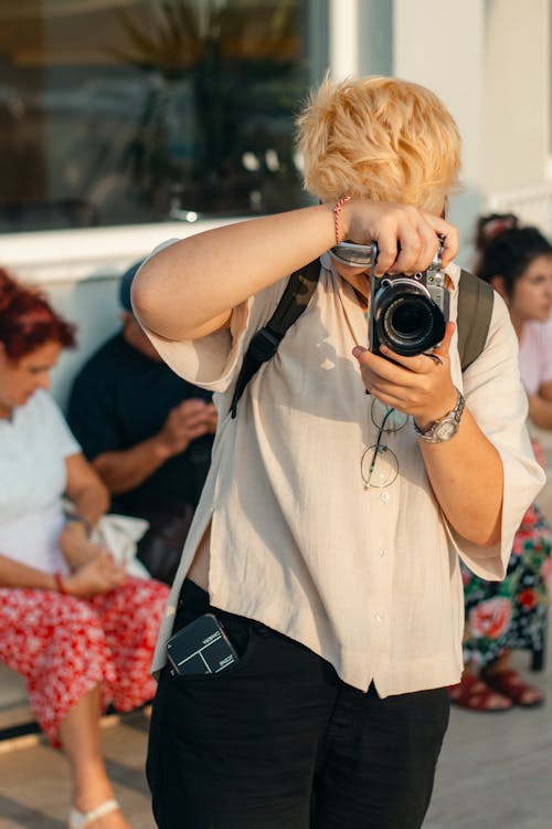 Photographer Taking Photo on Street