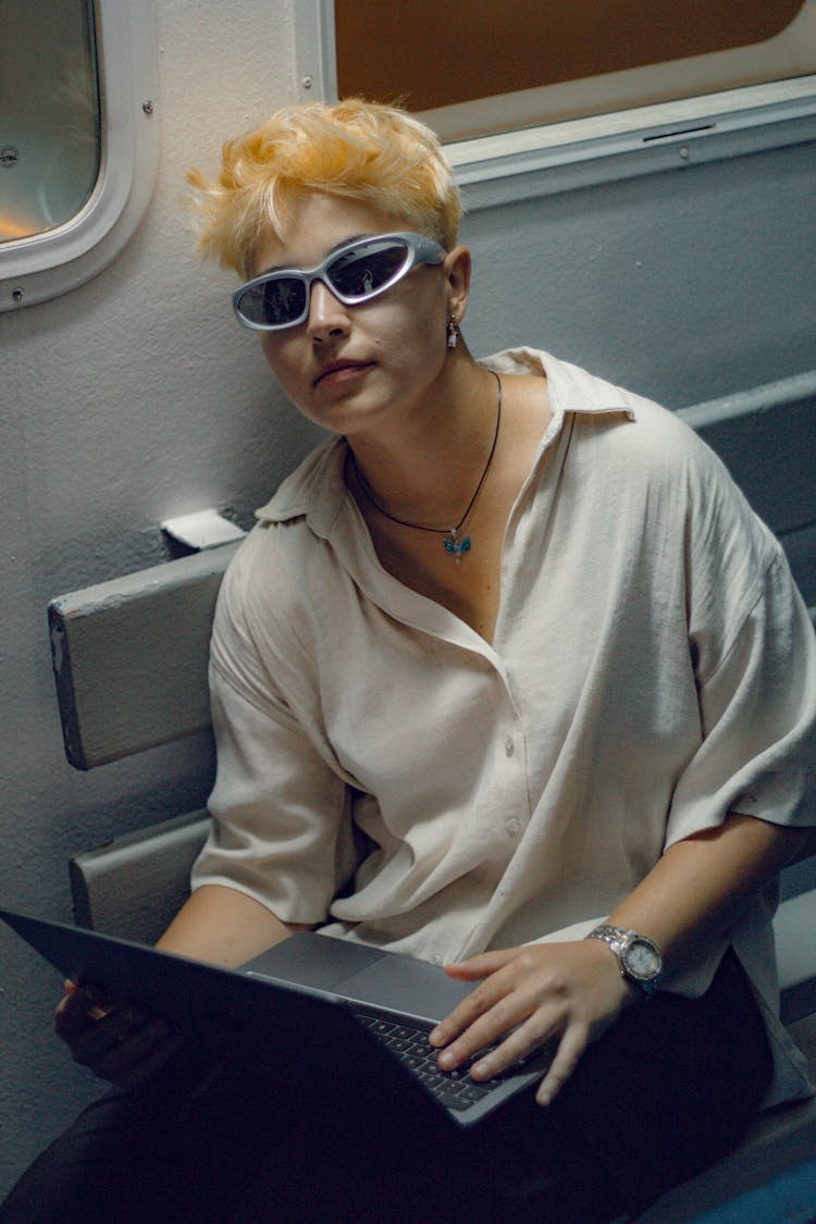 Woman Using A Laptop On A Train 