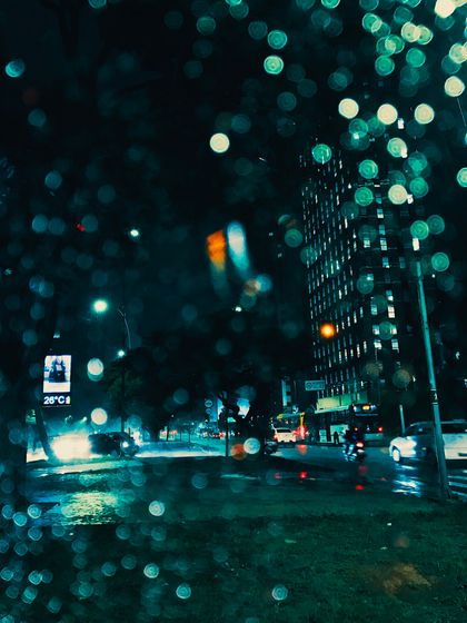 Empty highway at night under headlights, photo by Well Naves on Pexels