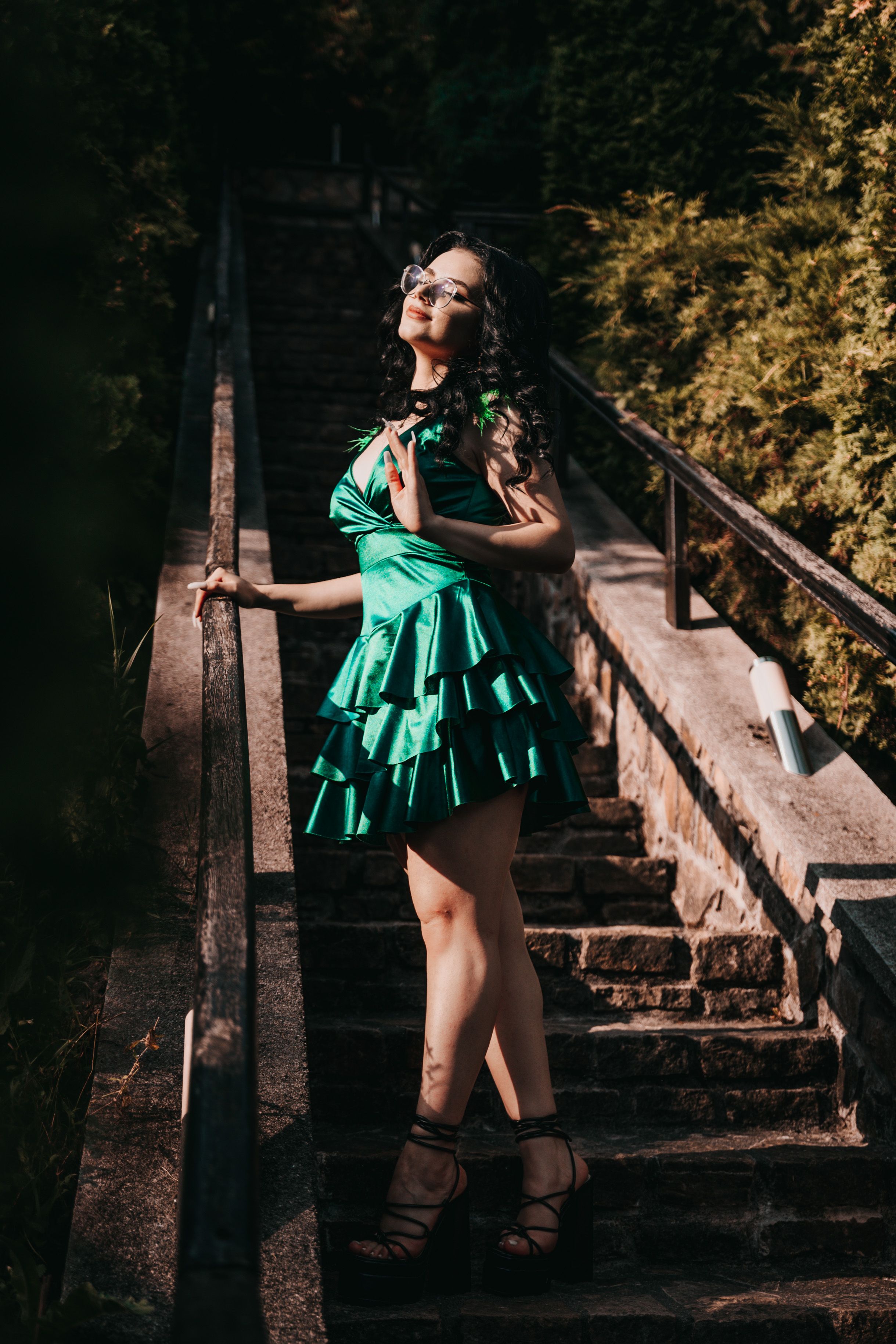 Woman in a Green Dress Standing on the Steps · Free Stock Photo