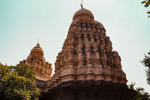 A beautiful view of a majestic Hindu temple showcasing intricate Mughal architecture.