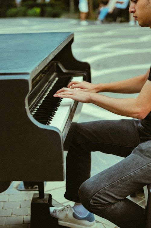 Man Playing Piano on Street