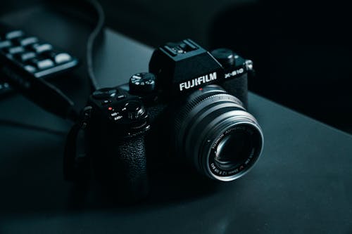 Fujifilm X-S10 Photo Camera Lying on a Black Table
