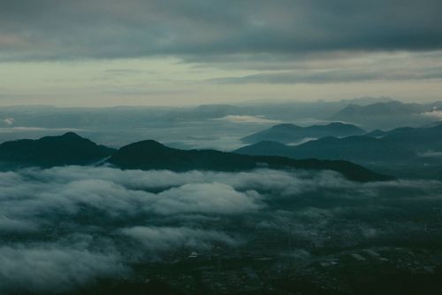 Free A serene mist-covered mountain landscape captured at Jaraguá do Sul, Brazil. Perfect for nature lovers. Stock Photo