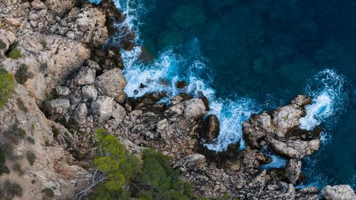 Free Breathtaking aerial shot of the rocky coastline in Marseille, France with vibrant blue waters. Stock Photo
