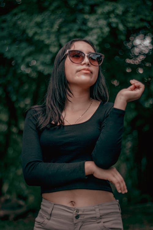 Woman in Sunglasses and Black Clothes