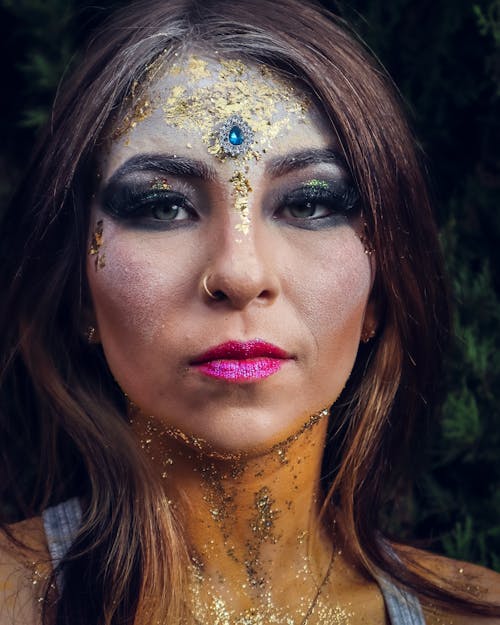 Portrait of Woman Wearing Glitter Makeup 