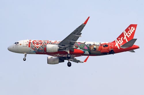 An AirAsia Airbus Flying against Clear Sky 