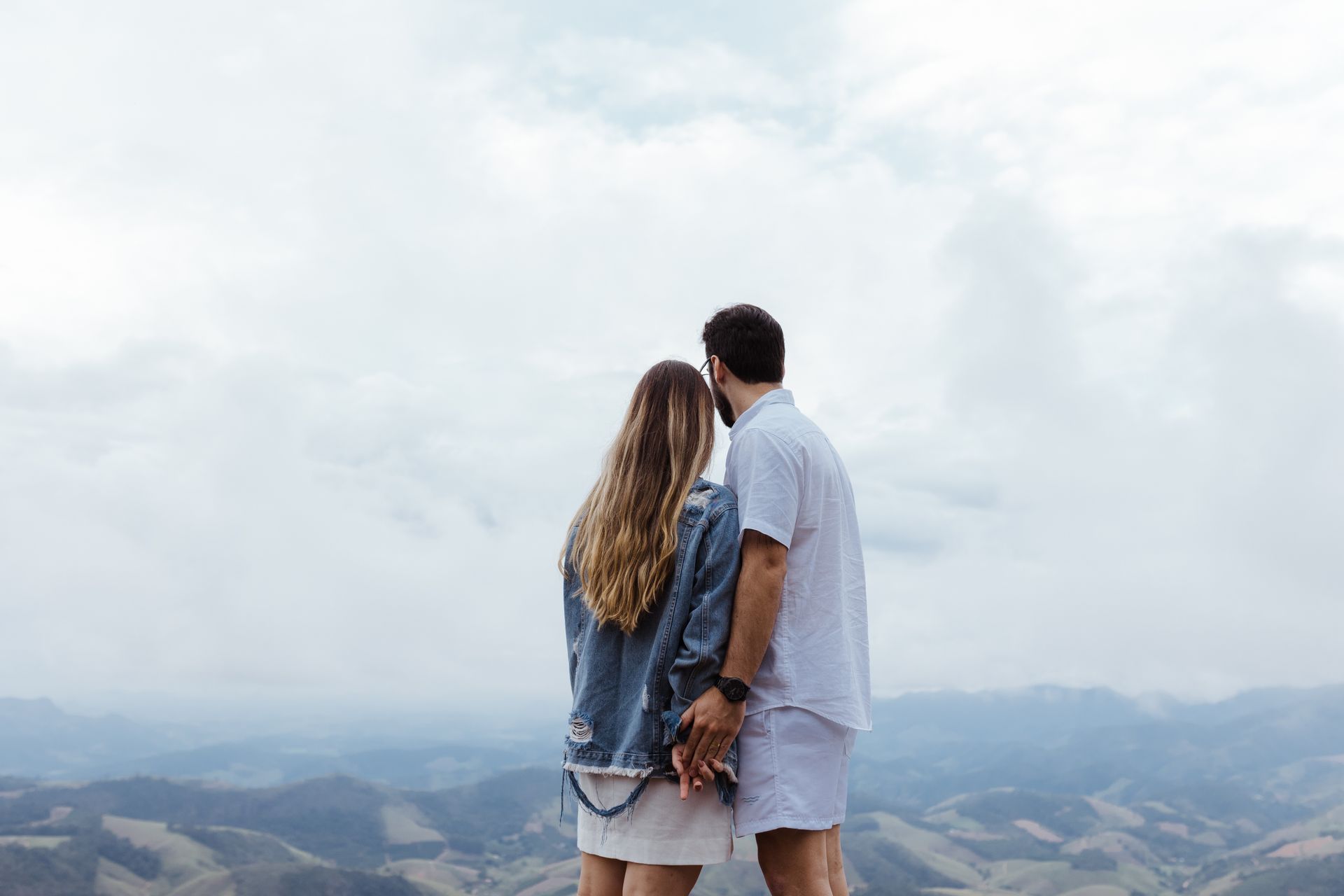 Cute Couple Standing Together in the Mountains