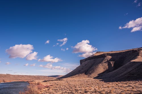 Sand Dunes Near Body of Water