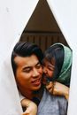 Woman Hugging Man in Gray Sweater