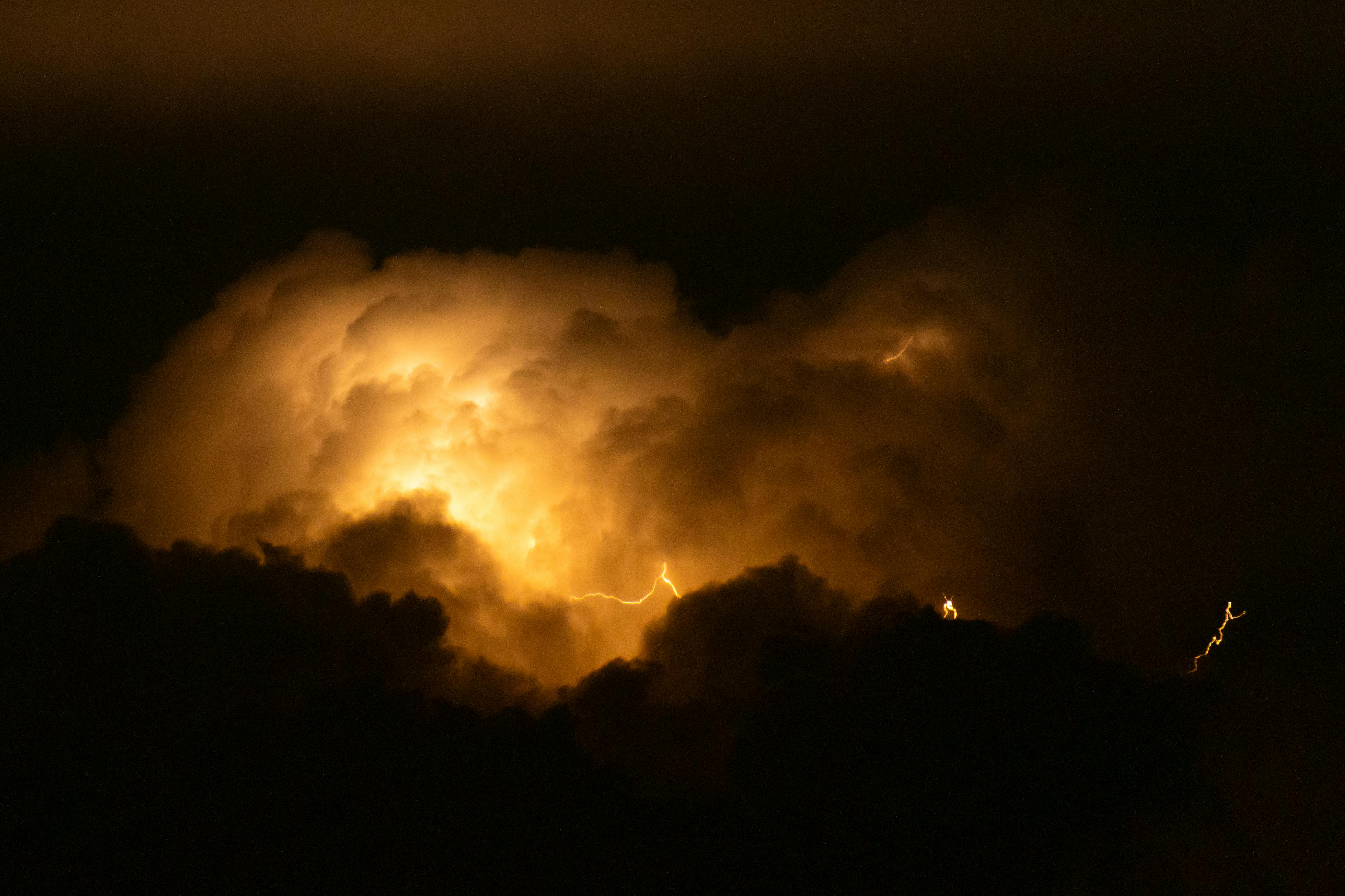 Majestic thunderstorm clouds illuminated by lightning over Warburton, VIC, Australia.