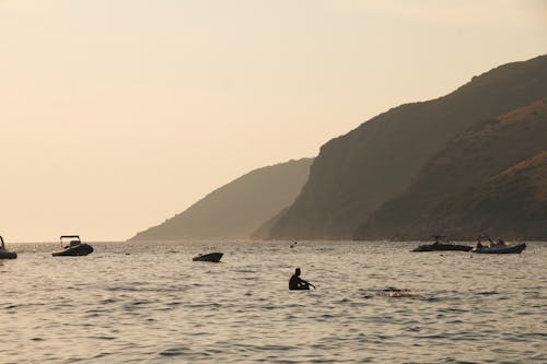 Photos gratuites de bateaux, bord de mer, coucher de soleil